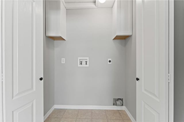 washroom featuring cabinet space, hookup for a washing machine, electric dryer hookup, and baseboards