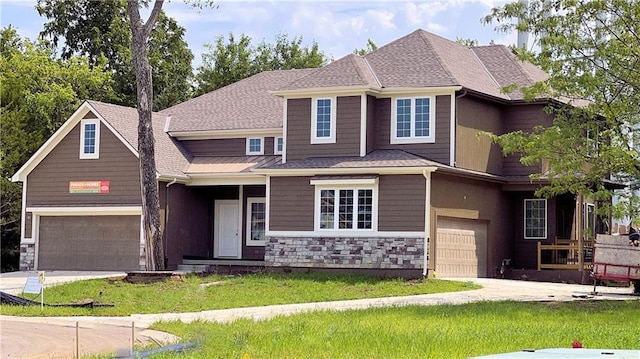 22309 W 76th St, Shawnee, KS 66227 - view of front facade with stone siding, driveway, a garage, and a front yard