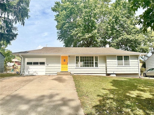 ranch-style home with an attached garage, a shingled roof, driveway, a front lawn, and a chimney