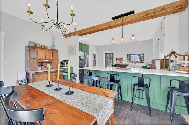 dining room featuring dark wood-style floors, beamed ceiling, and a chandelier