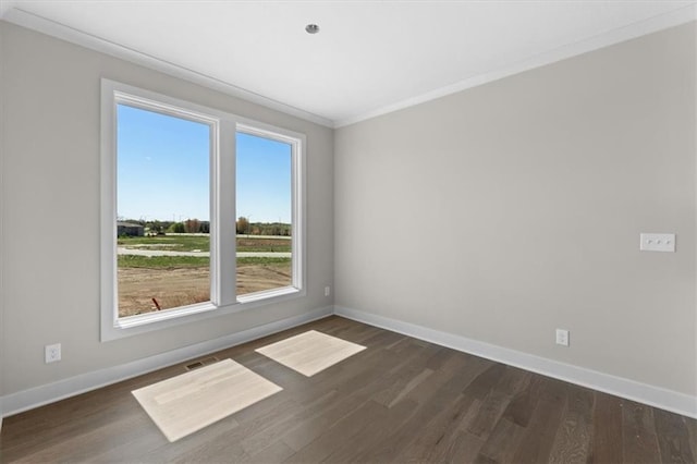 unfurnished room featuring baseboards and dark wood-type flooring