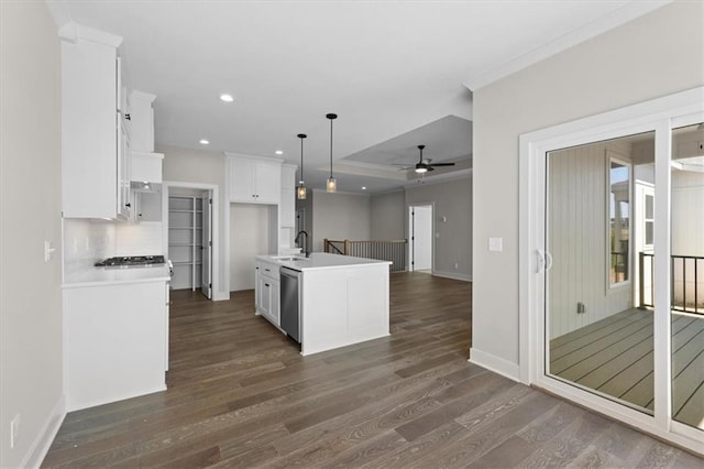 kitchen with white cabinets, dark wood-style floors, dishwasher, a ceiling fan, and open floor plan