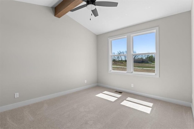 carpeted empty room with ceiling fan, baseboards, lofted ceiling with beams, and visible vents