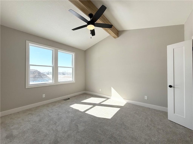 unfurnished room featuring vaulted ceiling with beams, ceiling fan, light carpet, and baseboards