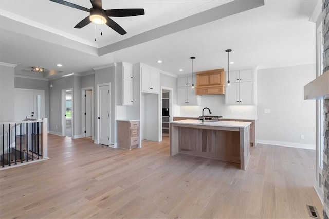 kitchen with a ceiling fan, crown molding, baseboards, light wood finished floors, and recessed lighting