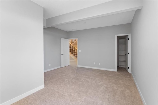 interior space with stairway and baseboards