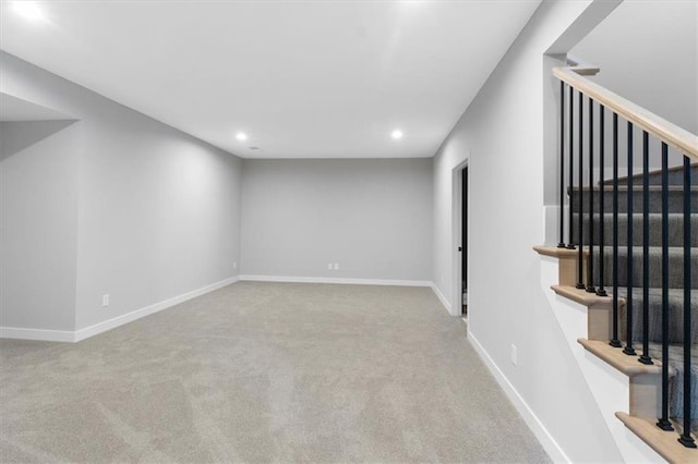 basement featuring stairway, carpet floors, baseboards, and recessed lighting