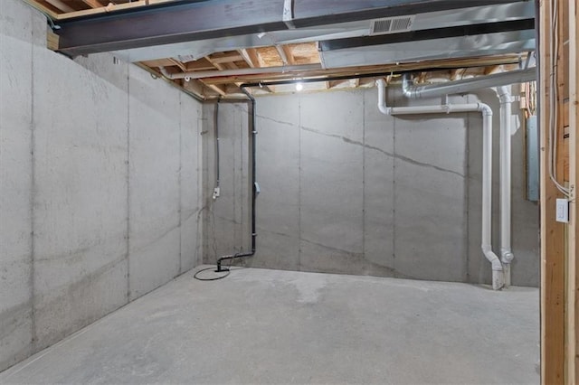 unfinished basement featuring visible vents