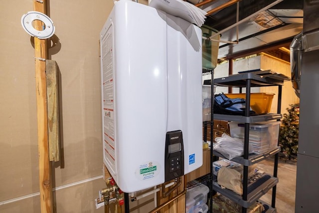 utility room featuring tankless water heater