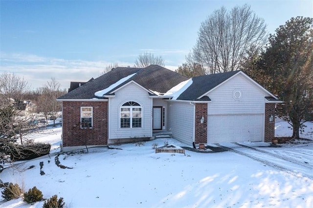 single story home featuring a garage and brick siding