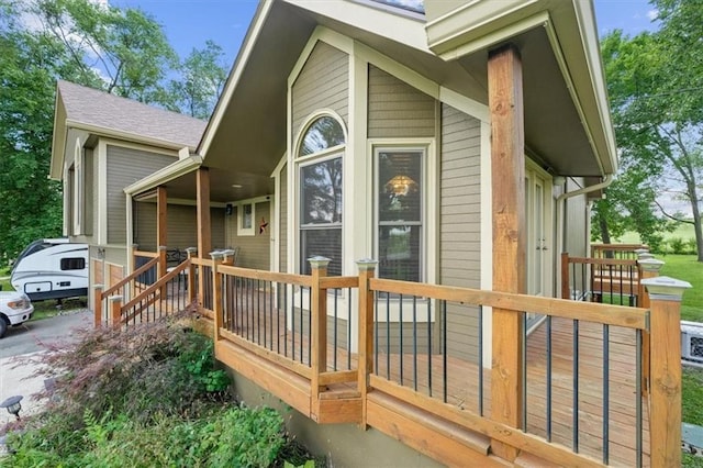 exterior space featuring a shingled roof