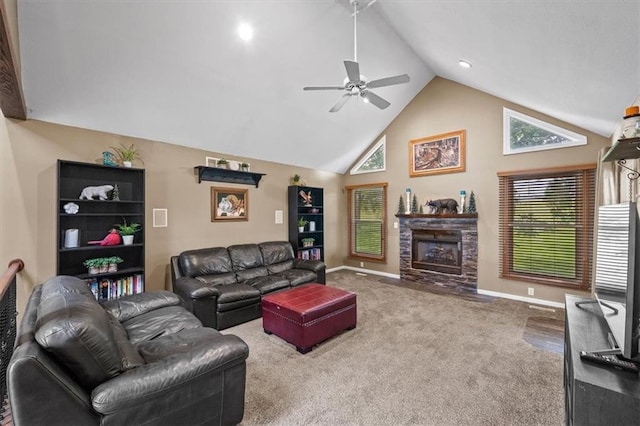 living room featuring carpet flooring, plenty of natural light, a stone fireplace, and baseboards