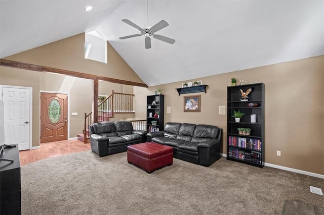 carpeted living area with baseboards, stairs, high vaulted ceiling, and a ceiling fan