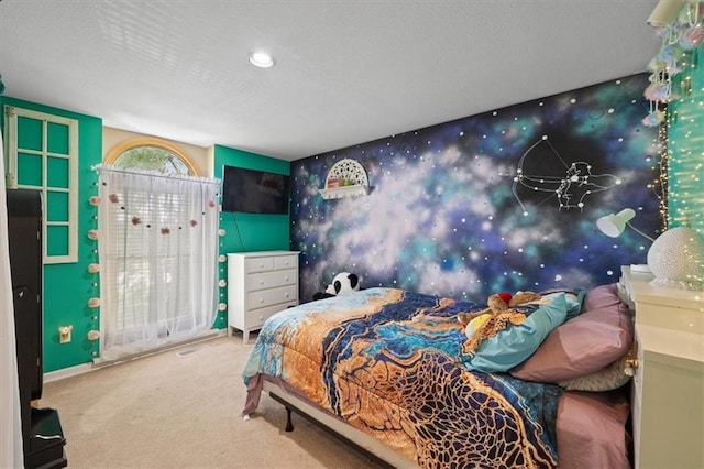 carpeted bedroom featuring a textured ceiling