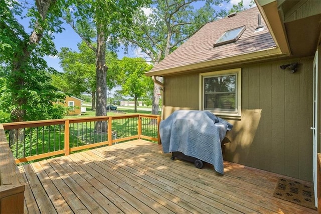 deck featuring a grill