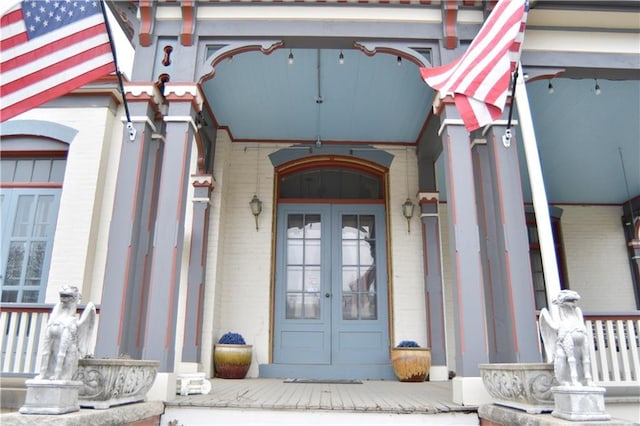 entrance to property with french doors and brick siding