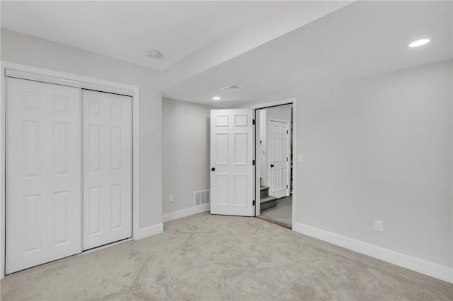 unfurnished bedroom featuring recessed lighting, carpet flooring, and baseboards