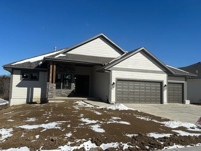 view of front facade with an attached garage and driveway