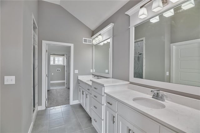 full bathroom with lofted ceiling, tile patterned flooring, a sink, visible vents, and double vanity