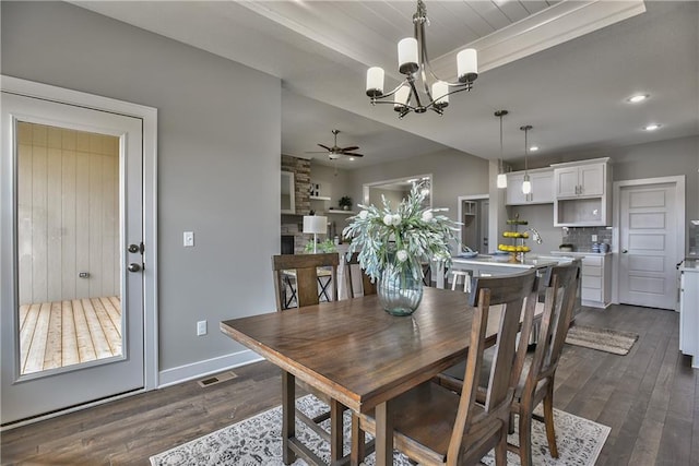 dining space with recessed lighting, baseboards, visible vents, dark wood-type flooring, and ceiling fan with notable chandelier