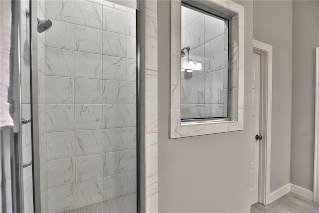 room details with a stall shower and baseboards