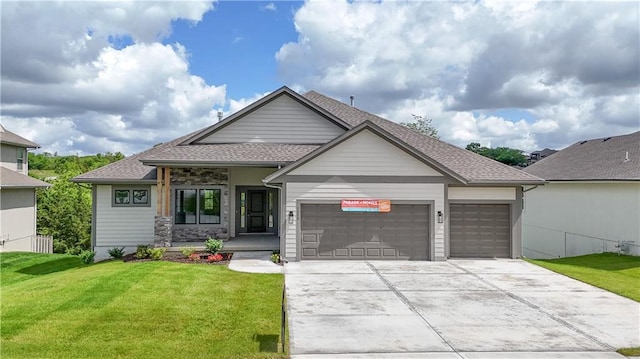 2850 W Wabash St, Olathe, KS 66061 - view of front of house with a garage, a front lawn, driveway, and a shingled roof