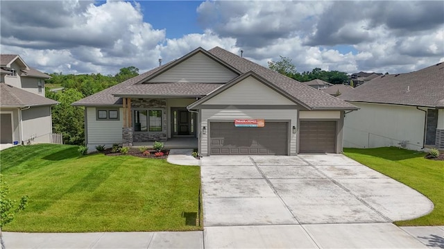 2850 W Wabash St, Olathe, KS 66061 - view of front facade with a garage, a front yard, driveway, and a shingled roof