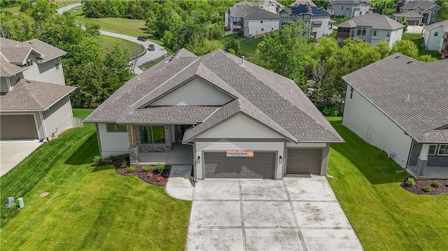 2850 W Wabash St, Olathe, KS 66061 - view of front of home featuring a garage, driveway, a shingled roof, and a residential view
