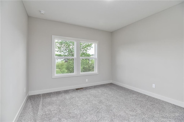 2850 W Wabash St, Olathe, KS 66061 - unfurnished room with baseboards, carpet, and a smoke detector