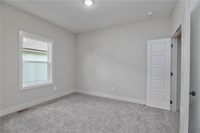 2850 W Wabash St, Olathe, KS 66061 - unfurnished room featuring carpet, baseboards, and a smoke detector