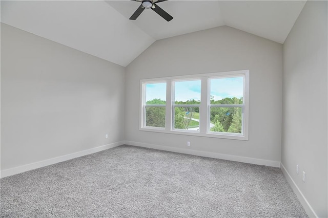 2850 W Wabash St, Olathe, KS 66061 - spare room featuring a ceiling fan, carpet floors, vaulted ceiling, and baseboards