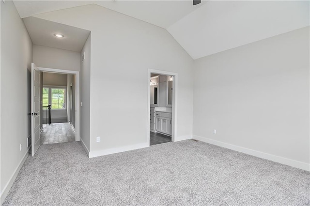 2850 W Wabash St, Olathe, KS 66061 - unfurnished bedroom with lofted ceiling, carpet flooring, baseboards, and ensuite bathroom