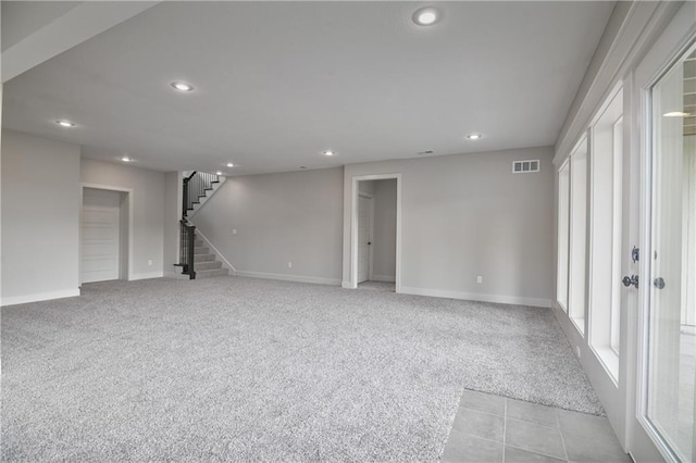 2850 W Wabash St, Olathe, KS 66061 - basement with recessed lighting, baseboards, light colored carpet, and stairway