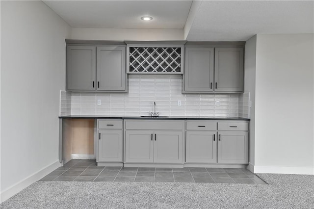 2850 W Wabash St, Olathe, KS 66061 - indoor bar featuring light carpet, tasteful backsplash, baseboards, and recessed lighting