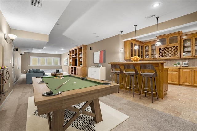 rec room featuring indoor wet bar, recessed lighting, visible vents, and light carpet