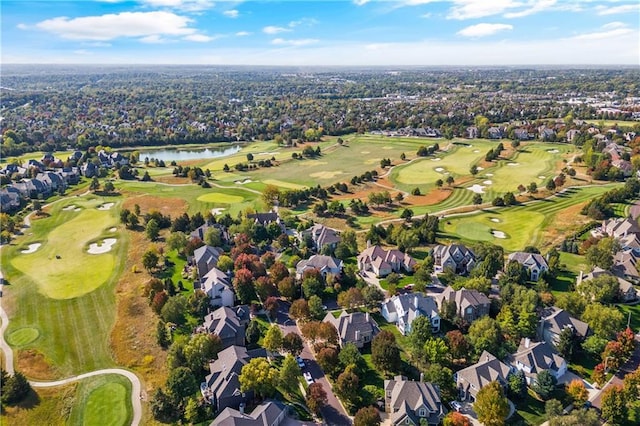 bird's eye view featuring a residential view, view of golf course, and a water view