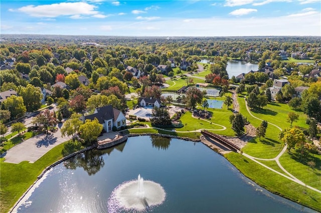 drone / aerial view with a water view and a residential view