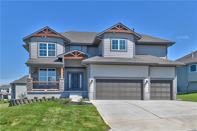 view of front of property featuring a shingled roof, concrete driveway, stone siding, and a front lawn