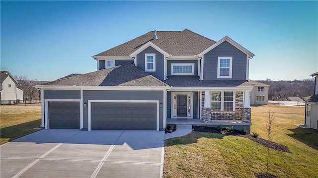 view of front facade featuring a front yard, a porch, an attached garage, a shingled roof, and concrete driveway