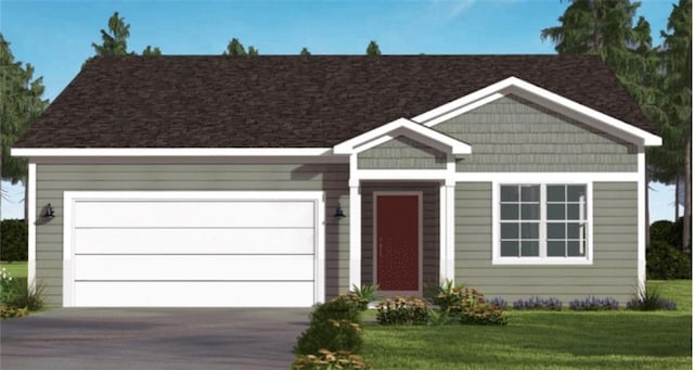 ranch-style house featuring a garage, driveway, and a front yard