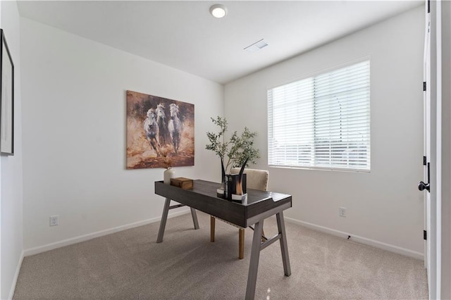 office area with light colored carpet and baseboards