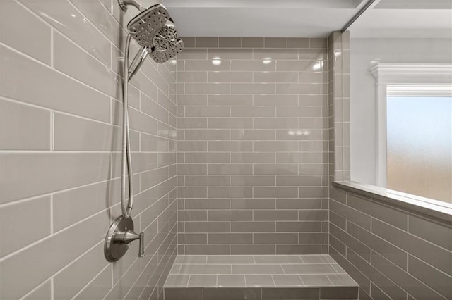 full bathroom with tiled shower