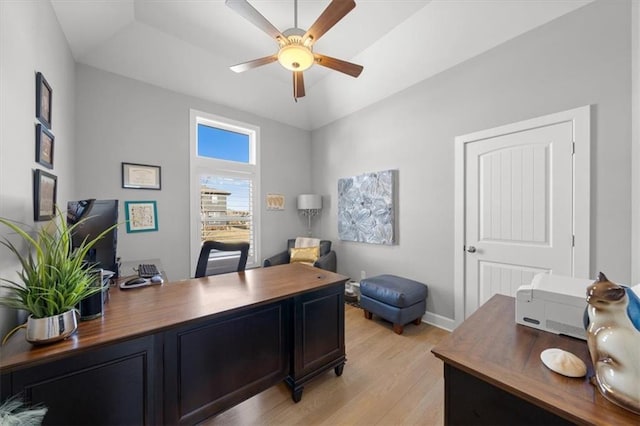 office featuring ceiling fan, light wood-style flooring, and baseboards