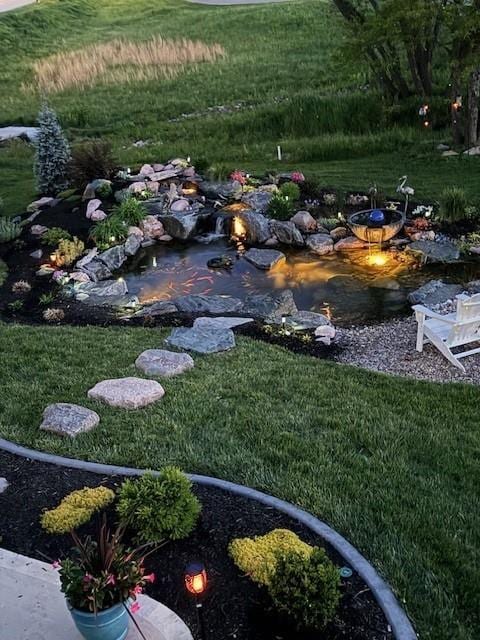 view of yard with a garden pond