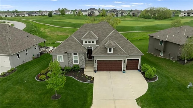 14423 N 145th St, Basehor, KS 66007 - view of front facade with a garage, a residential view, driveway, and stone siding