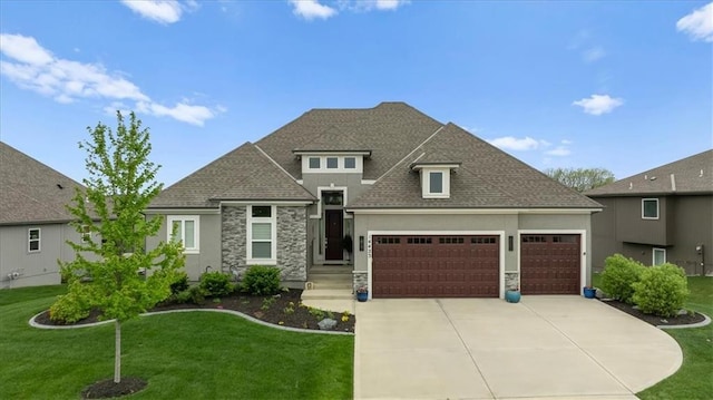 14423 N 145th St, Basehor, KS 66007 - view of front of house featuring a garage, a front yard, driveway, and stone siding