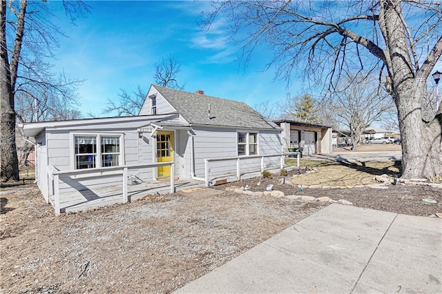 view of front of house featuring a shingled roof