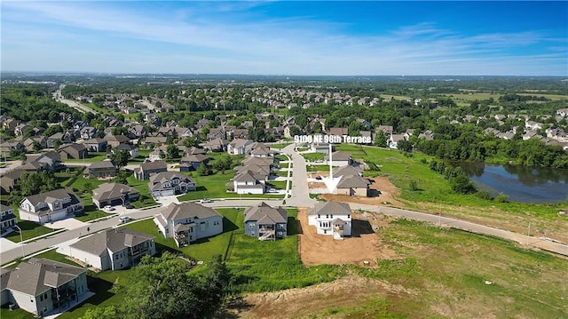 9100 NE 98th Ter, Kansas City, MO 64157 - aerial view of property and surrounding area with nearby suburban area and a large body of water