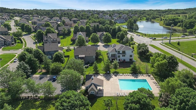 9100 NE 98th Ter, Kansas City, MO 64157 - aerial perspective of suburban area with a pool and a nearby body of water