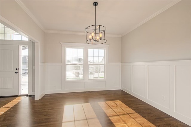 9100 NE 98th Ter, Kansas City, MO 64157 - entryway with a decorative wall, a chandelier, dark wood-style flooring, wainscoting, and ornamental molding